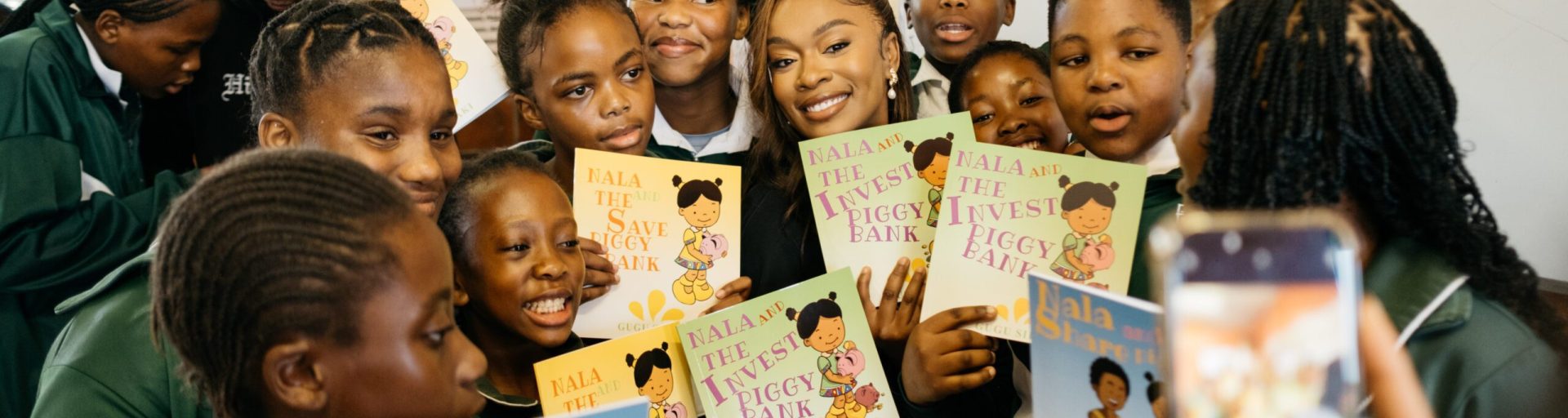 Nomzamo with learners at John Pama school
