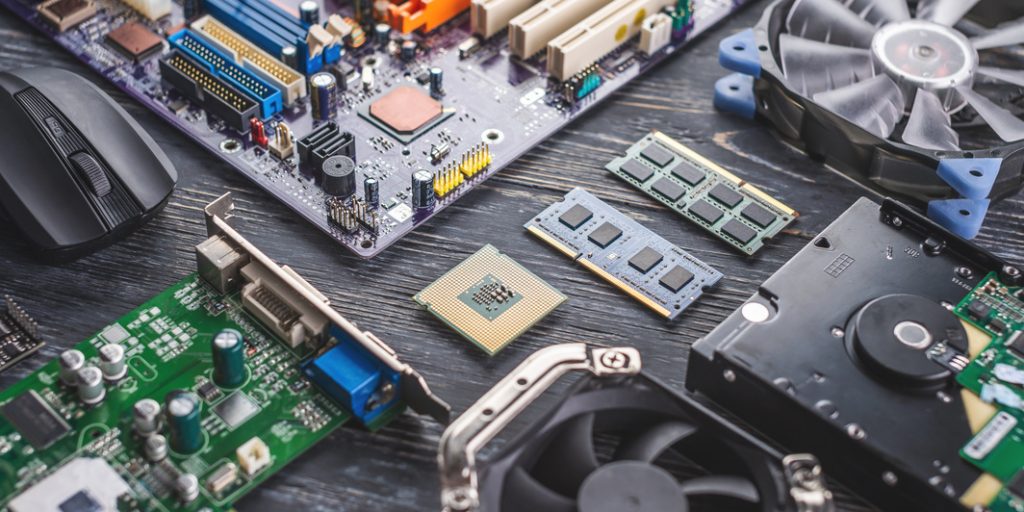 Computer hardware configuration is laid out on a dark background. Concept of a modern solid-state digital technology